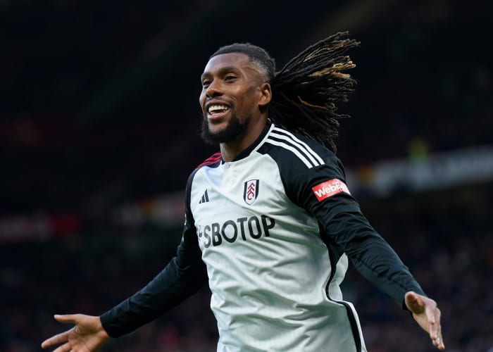 Alex Iwobi pictured celebrating after scoring a late winning goal for Fulham in a 2-1 victory at Manchester United in February 2024